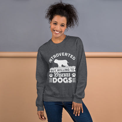 Model wearing a sweatshirt in Dark Heather with a white dog silhouette and Introverted But Willing to Discuss Dogs lettering
