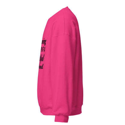 Side view of a sweatshirt in Heliconia with part of the memorial chest print visible