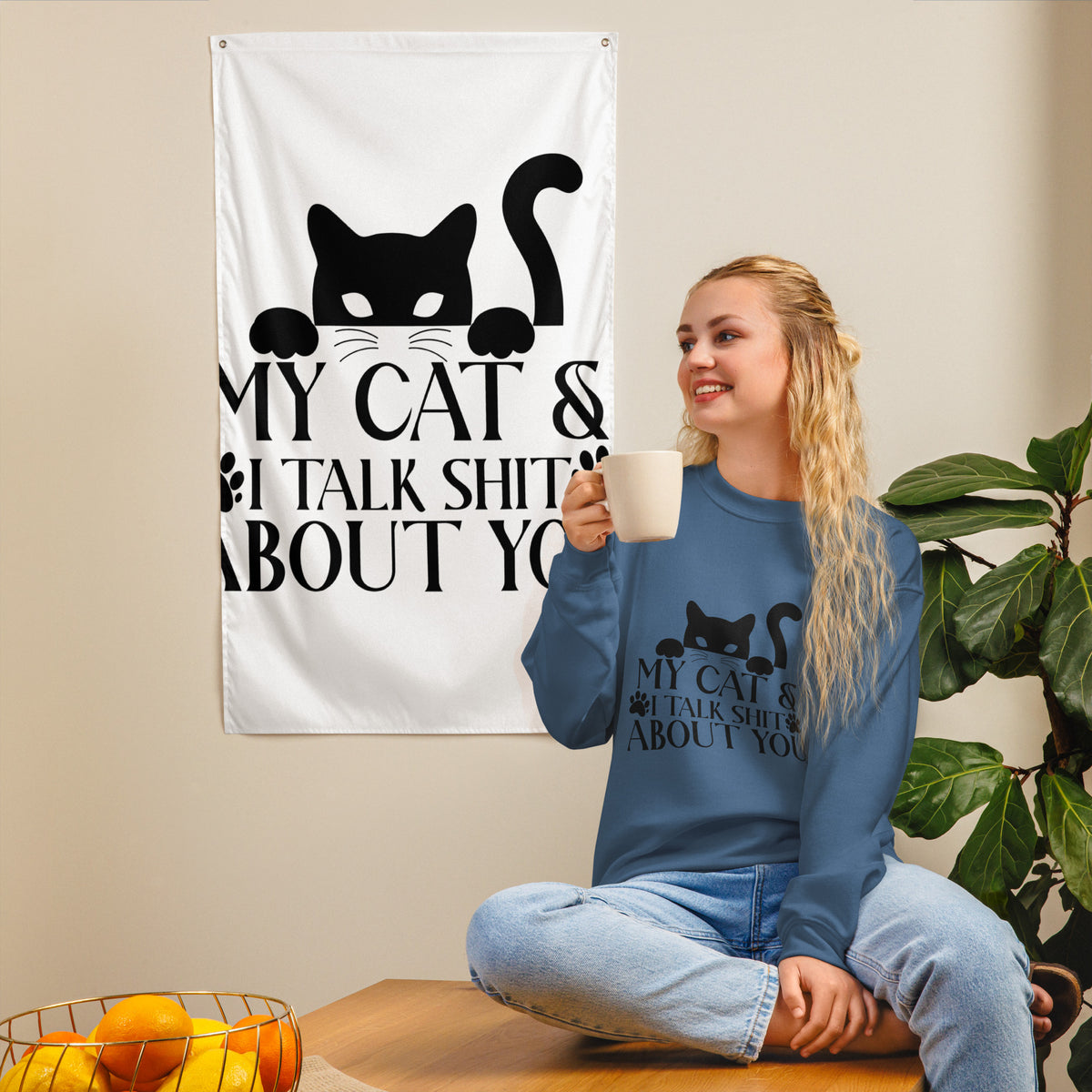 Model wearing a sweatshirt in Indigo Blue with a black cat graphic and My Cat and I Talk Shit About You lettering
