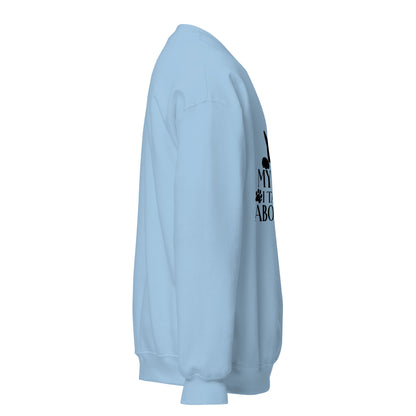Side view of a sweatshirt in Light Blue with part of the black cat chest graphic visible