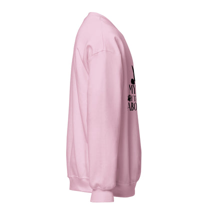 Side view of a sweatshirt in Light Pink with part of the black cat chest graphic visible