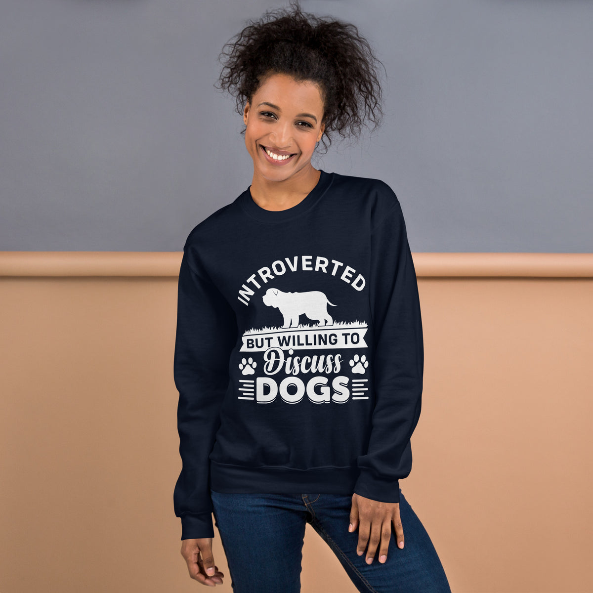 Model wearing a sweatshirt in Navy with a white dog silhouette and Introverted But Willing to Discuss Dogs lettering