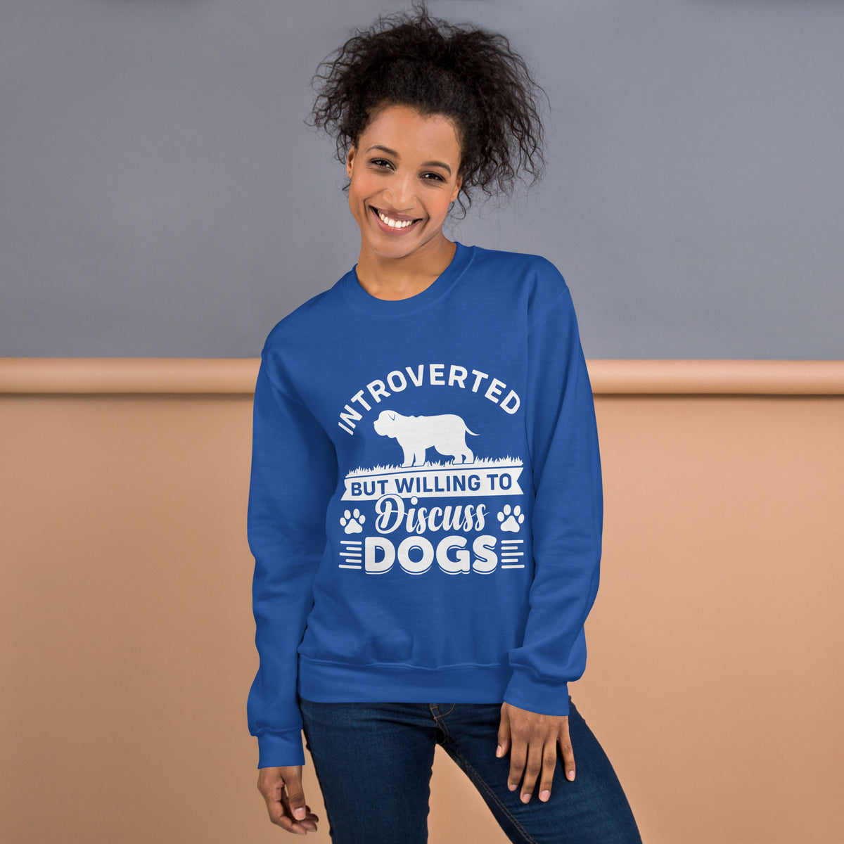 Model wearing a sweatshirt in Royal with a white dog silhouette and Introverted But Willing to Discuss Dogs lettering