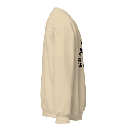 Side view of a sweatshirt in Sand with part of the black cat chest graphic visible