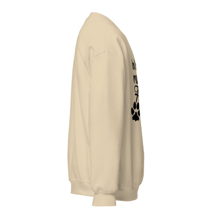 Side view of a sweatshirt in Sand with part of the memorial chest print visible