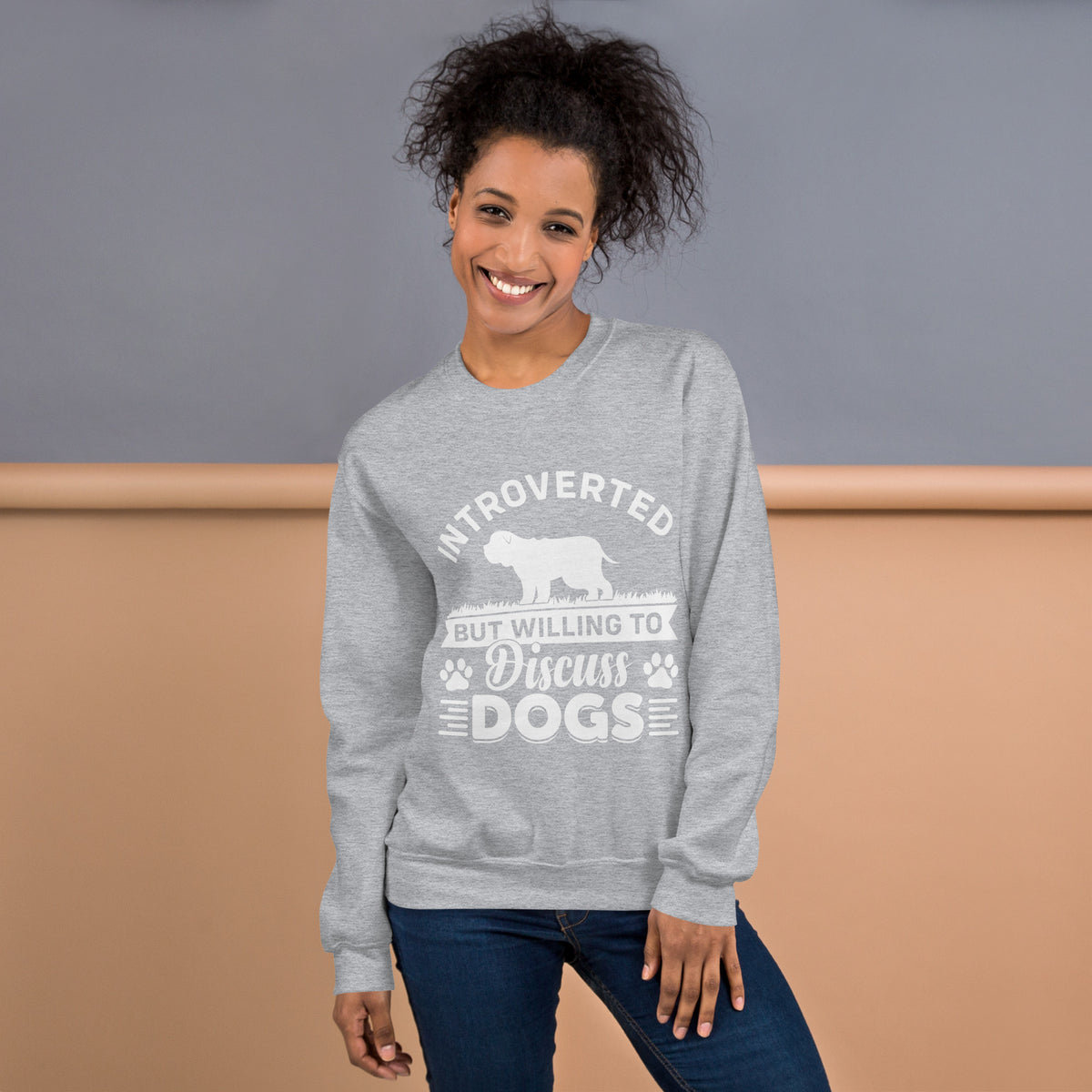 Model wearing a sweatshirt in Sport Grey with a white dog silhouette and Introverted But Willing to Discuss Dogs lettering