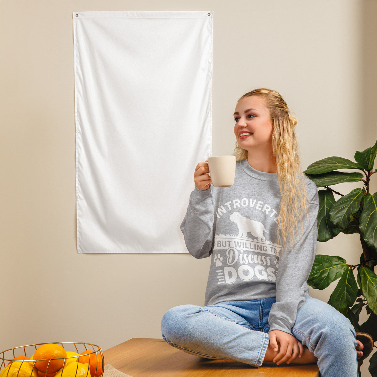 Model wearing a sweatshirt in Sport Grey with a white dog silhouette and Introverted But Willing to Discuss Dogs lettering